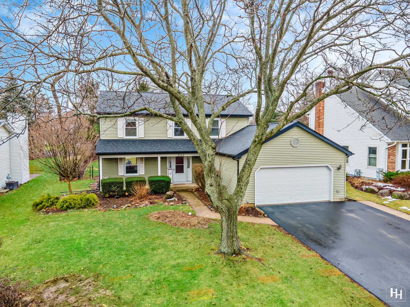 355 Hillhurst Drive Cary, IL 60013 - Photo 1 of 29 a front view of a house with garden