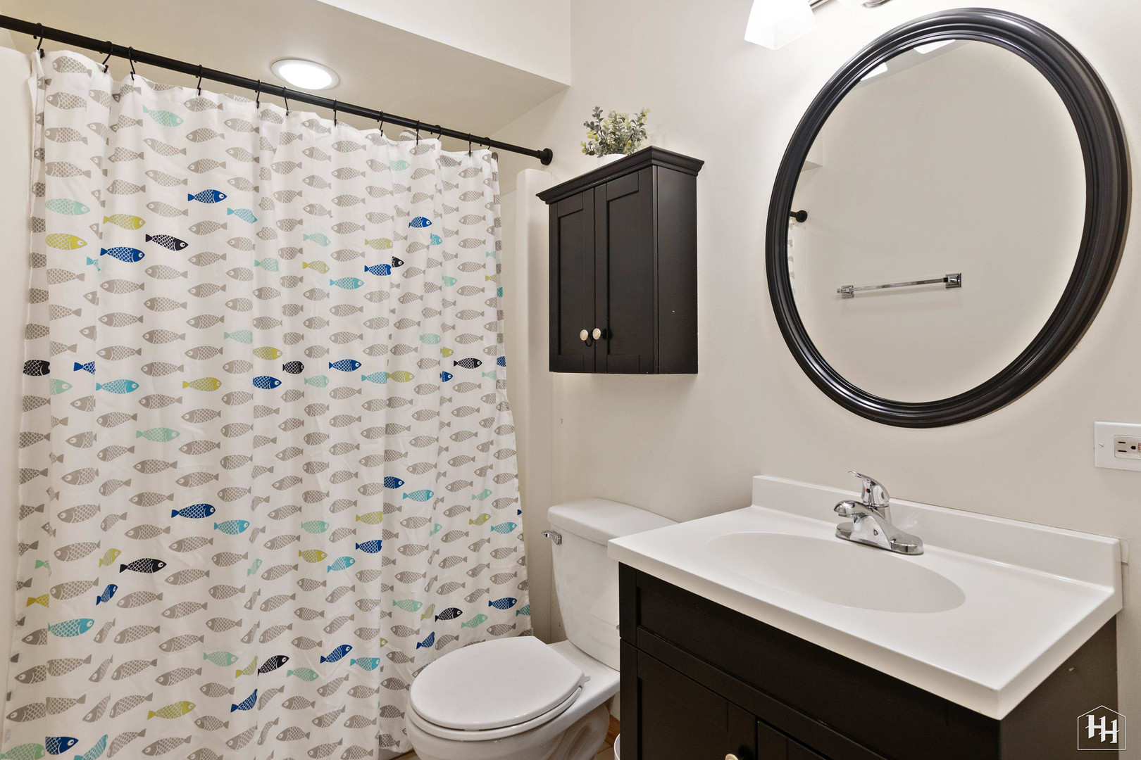355 Hillhurst Drive Cary, IL 60013 - Photo 14 of 29 a bathroom with a sink a toilet and a mirror