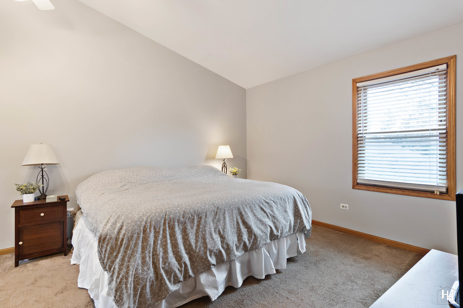 355 Hillhurst Drive Cary, IL 60013 - Photo 15 of 29 a bedroom with a bed and a lamp