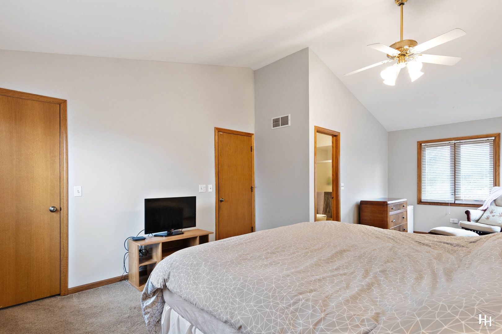 355 Hillhurst Drive Cary, IL 60013 - Photo 16 of 29 a bedroom with a bed and a flat screen tv