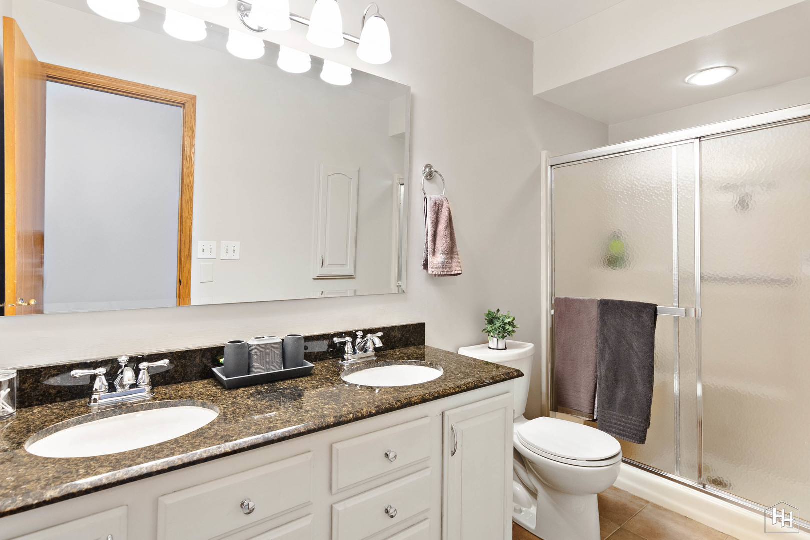 355 Hillhurst Drive Cary, IL 60013 - Photo 18 of 29 a bathroom with a granite countertop sink toilet and shower