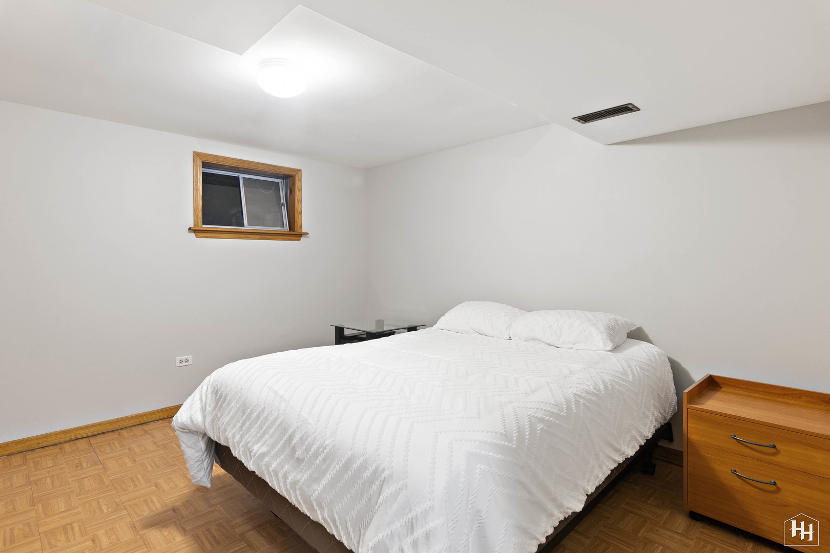 355 Hillhurst Drive Cary, IL 60013 - Photo 21 of 29 a bedroom with a bed and a lamp on the dresser