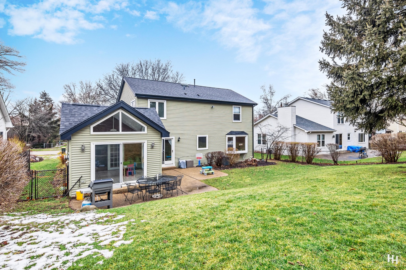 355 Hillhurst Drive Cary, IL 60013 - Photo 24 of 29 a view of a house with table and chairs in a patio