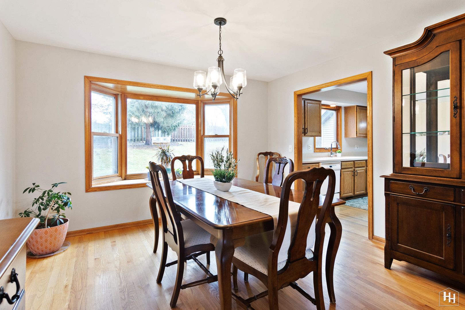 355 Hillhurst Drive Cary, IL 60013 - Photo 9 of 29 a view of a dining room with furniture window and wooden floor
