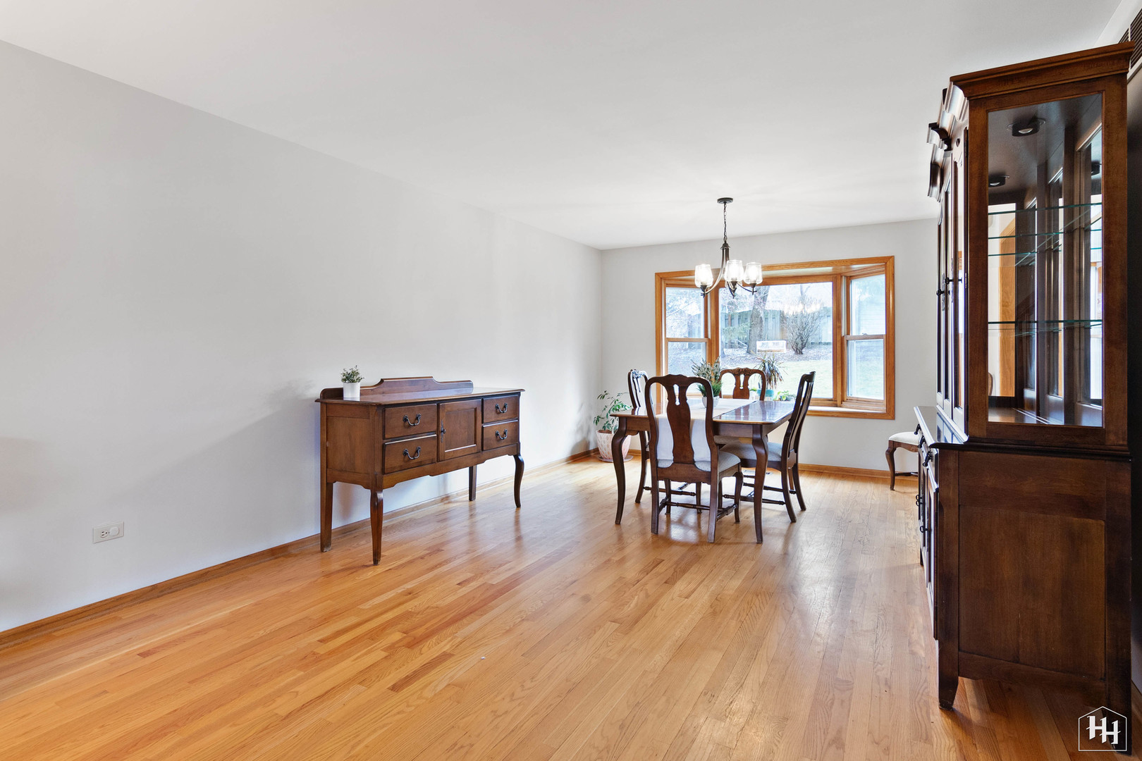 355 Hillhurst Drive Cary, IL 60013 - Photo 10 of 29 a dining room with furniture window wooden floor