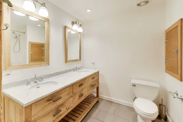 a bathroom with a bath tub with a shower