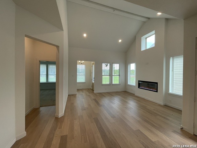 9431 Hidden Stone Schertz, TX 78154 - Photo 7 of 30 an empty room with wooden floor and windows