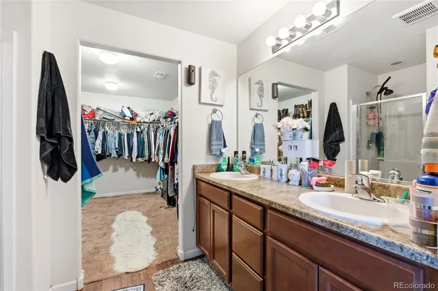 a bathroom with a sink a vanity and a mirror