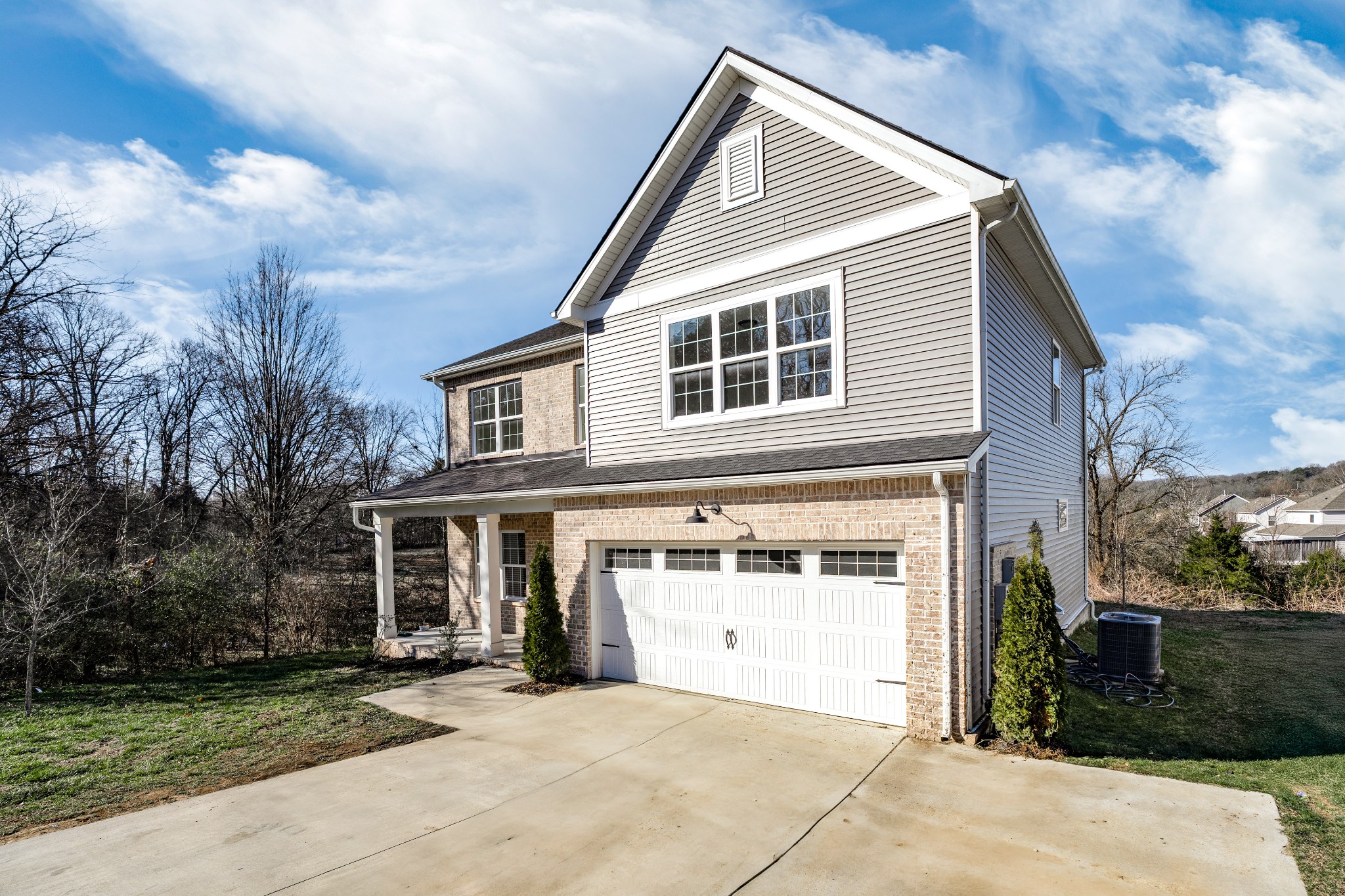 873 Preston Road Antioch, TN 37013 - Photo 2 of 36 a front view of a house with a yard and garage