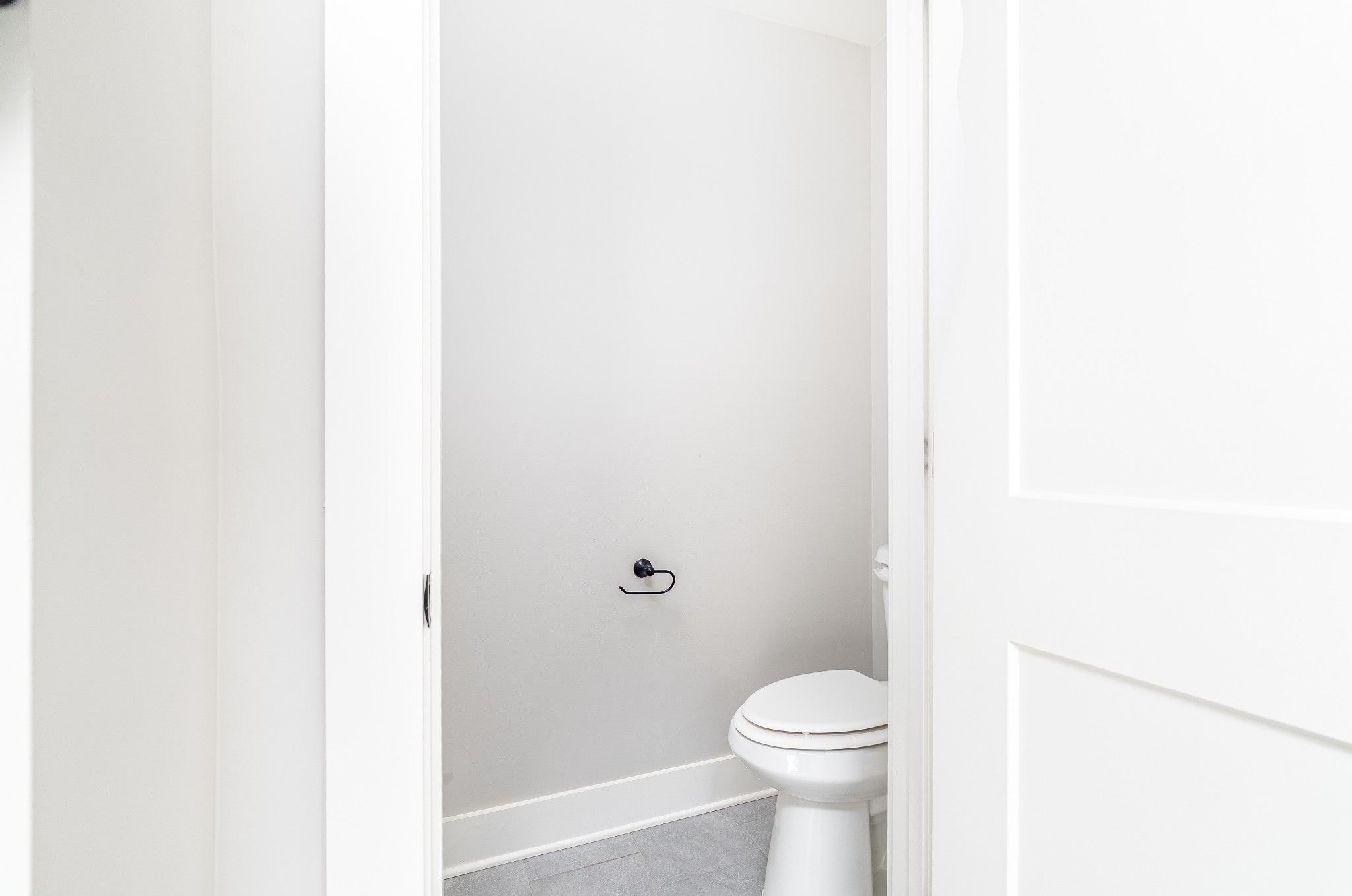 873 Preston Road Antioch, TN 37013 - Photo 24 of 36 a white toilet sitting next to a white cabinet