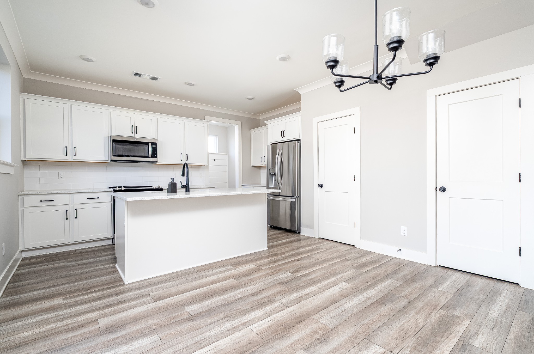 873 Preston Road Antioch, TN 37013 - Photo 8 of 36 a view of kitchen with sink microwave and refrigerator