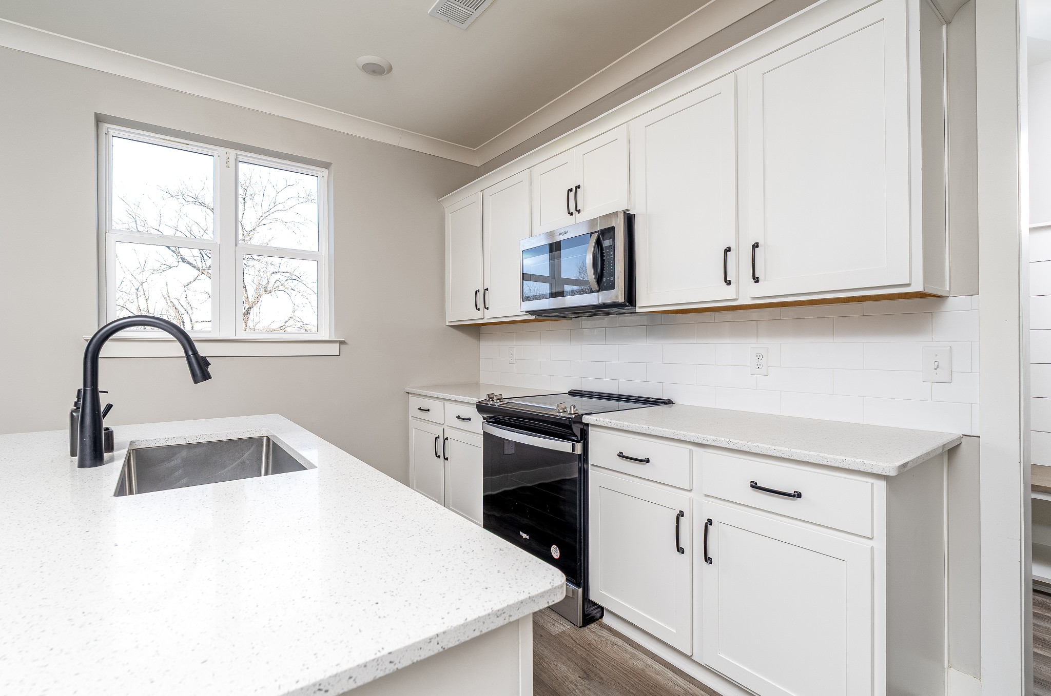 873 Preston Road Antioch, TN 37013 - Photo 9 of 36 a kitchen with stainless steel appliances granite countertop a stove a sink and a microwave