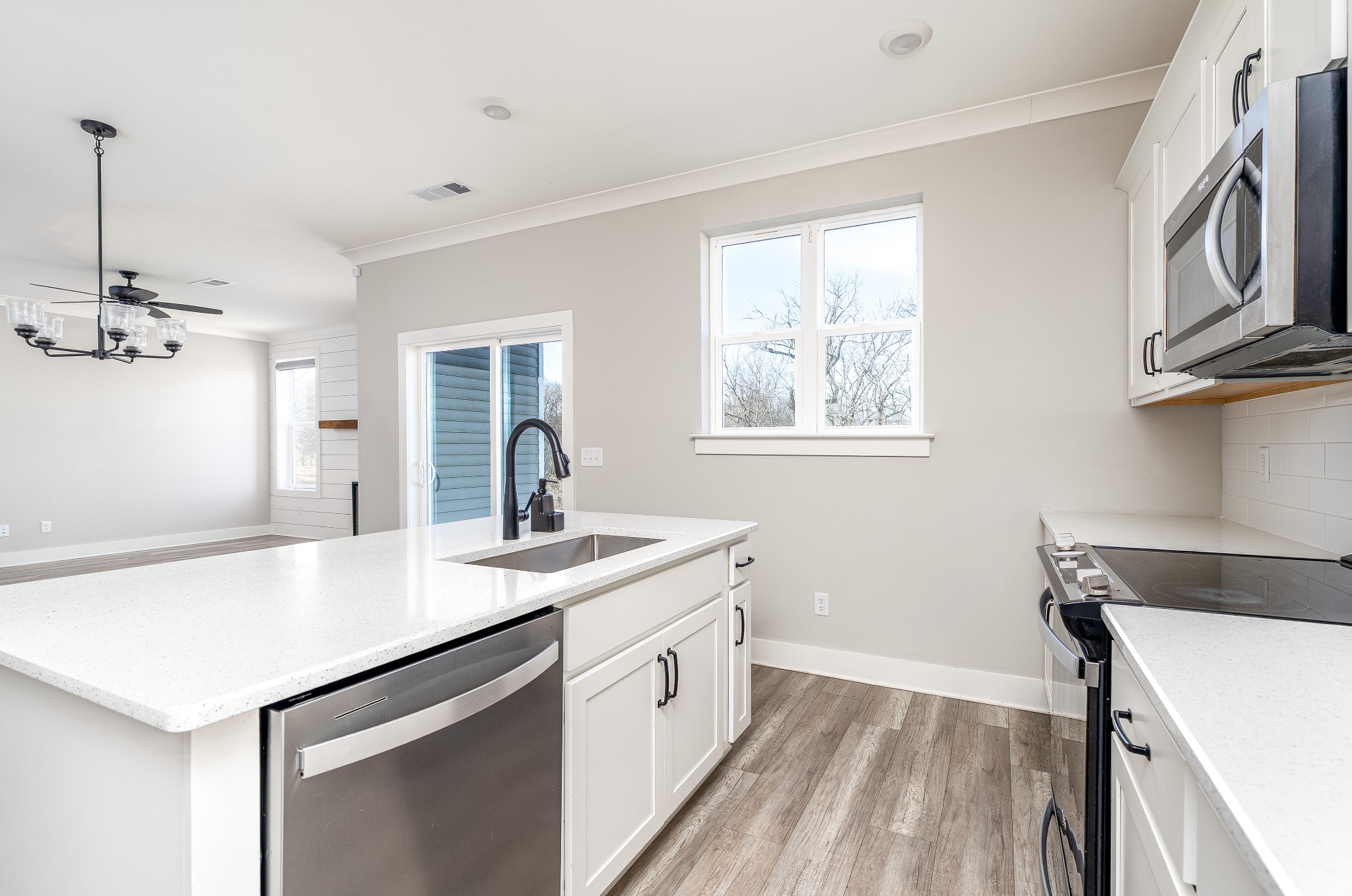 873 Preston Road Antioch, TN 37013 - Photo 10 of 36 a kitchen with a sink dishwasher a stove and a refrigerator with wooden floor