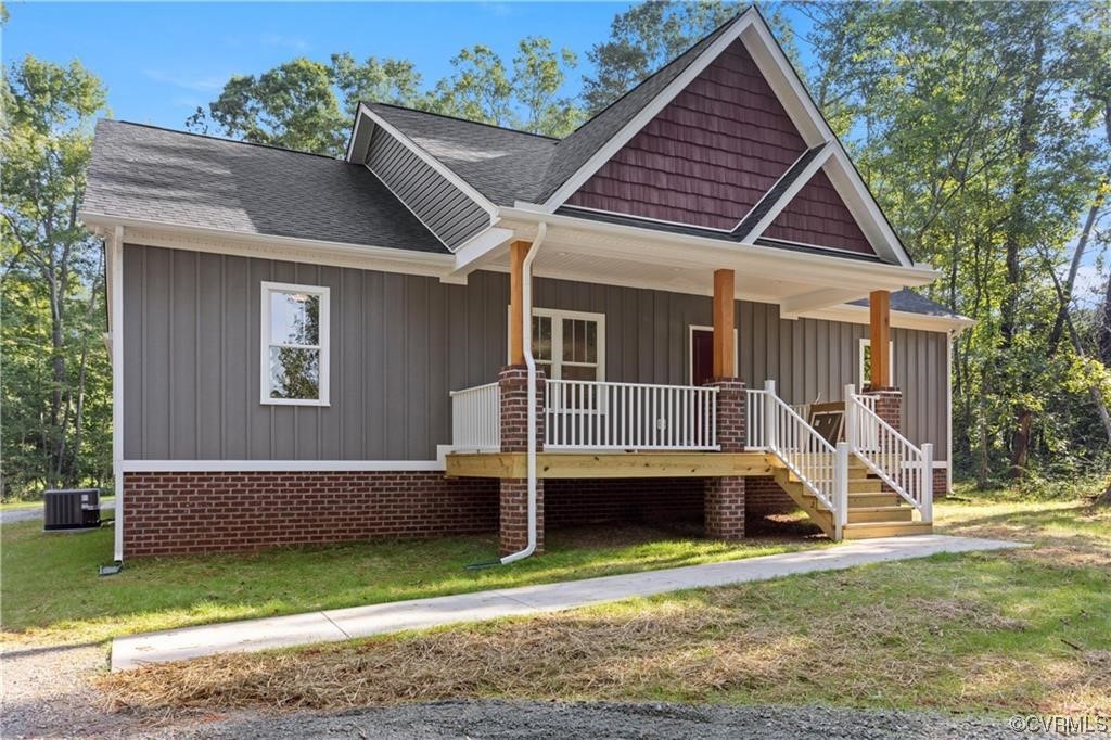 3125 Paynes Mill Road Bumpass, VA 23024 - Photo 3 of 11 a front view of a house with a yard