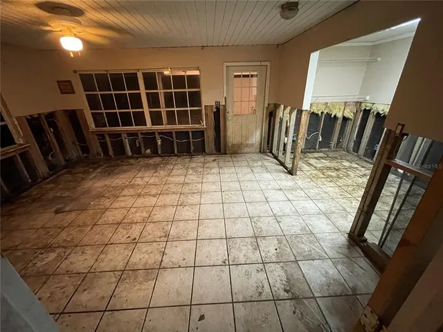 a view of empty room with windows