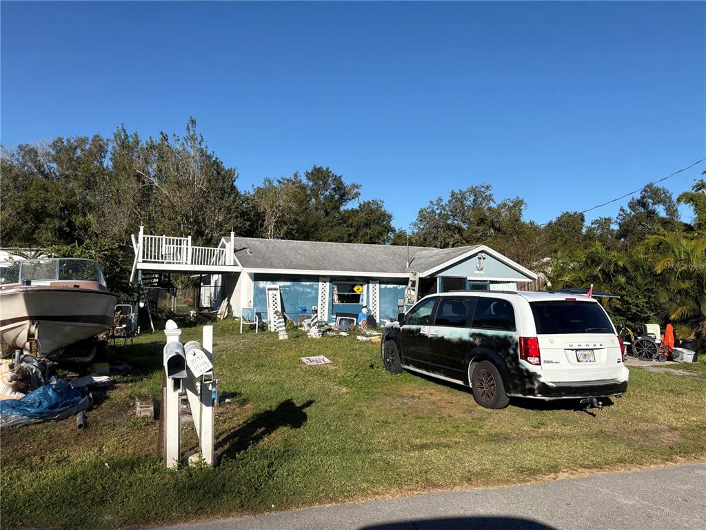 10162 Southwest Riverview Circle Arcadia, FL 34269 - Photo 2 of 21 a car parked in front of a house