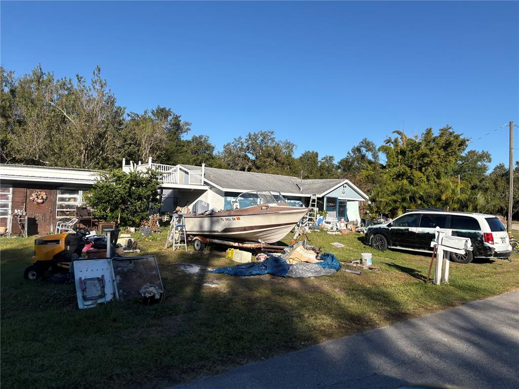 10162 Southwest Riverview Circle Arcadia, FL 34269 - Photo 5 of 21 a roof deck with table and chairs and potted plants