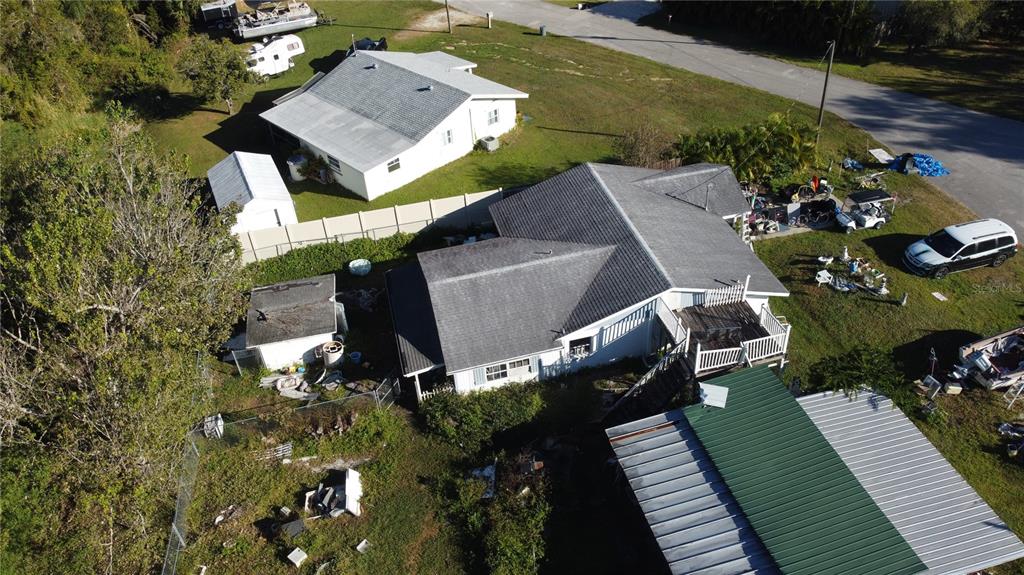 10162 Southwest Riverview Circle Arcadia, FL 34269 - Photo 9 of 21 an aerial view of a house with a yard and furniture