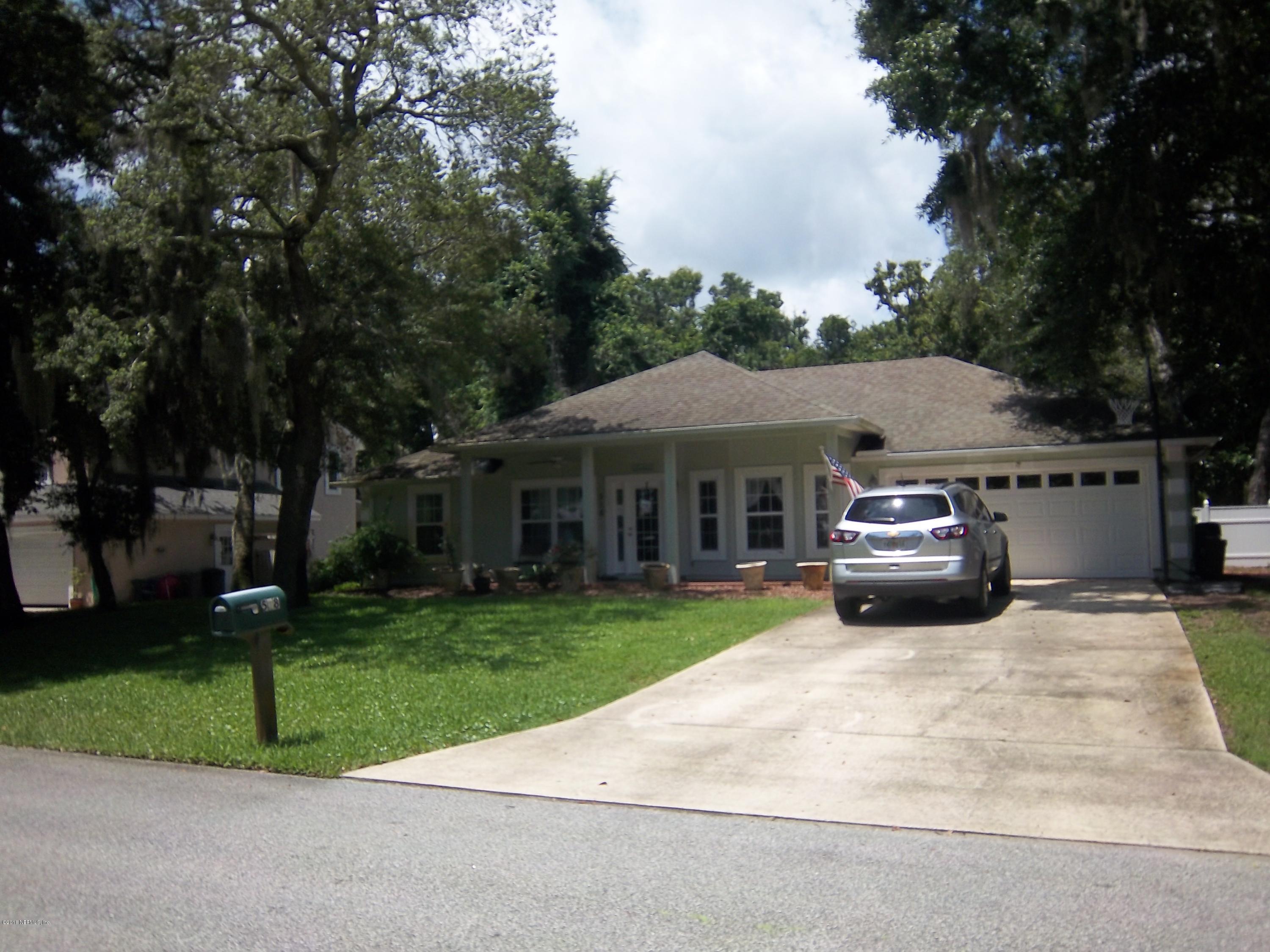 518 Jasmine Road St. Augustine, FL 32086 - Photo 3 of 27 a view of house with outdoor space and garden