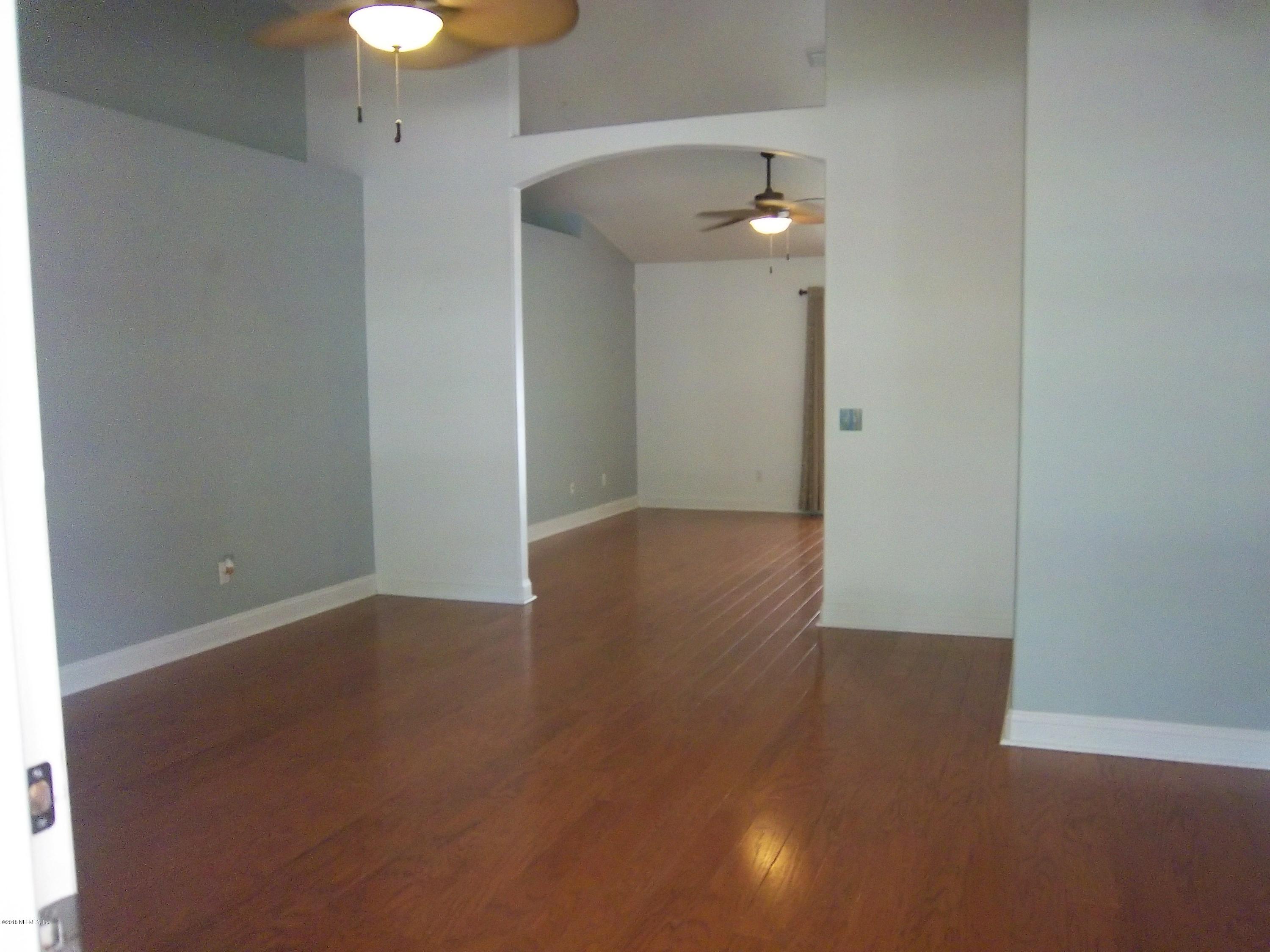 518 Jasmine Road St. Augustine, FL 32086 - Photo 4 of 27 a view of empty room with wooden floor