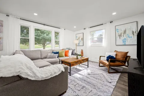 a kitchen with stainless steel appliances a refrigerator stove and microwave