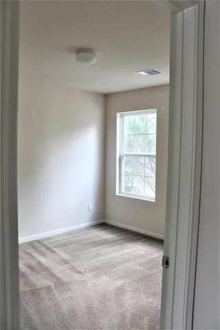 a view of an empty room and window