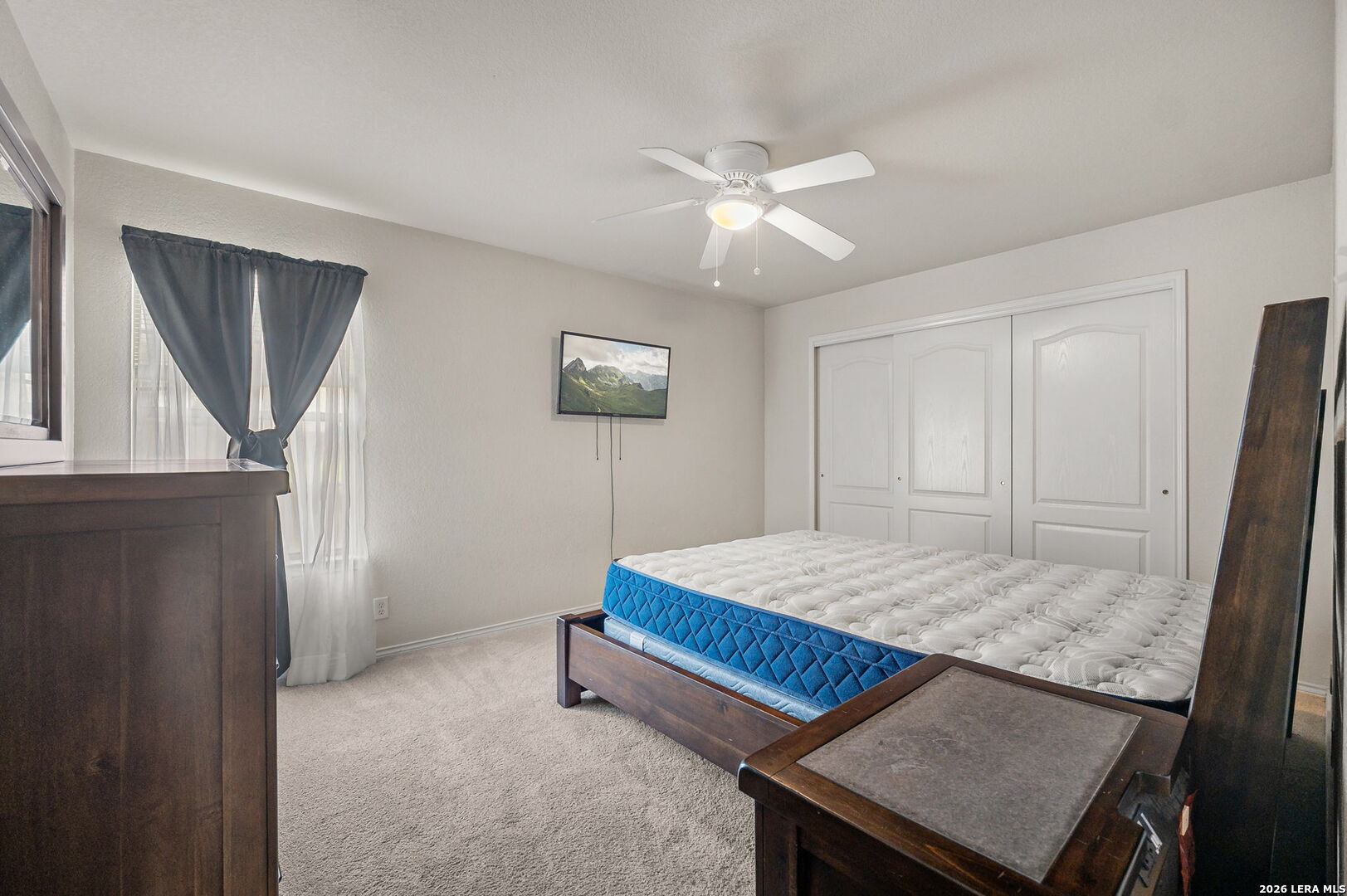 7207 Avery Road Live Oak, TX 78233 - Photo 22 of 32 a bedroom with a bed and a mirror