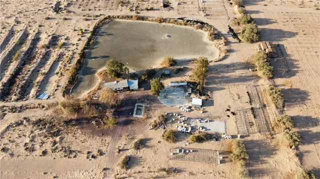 a front view of a building with sitting area