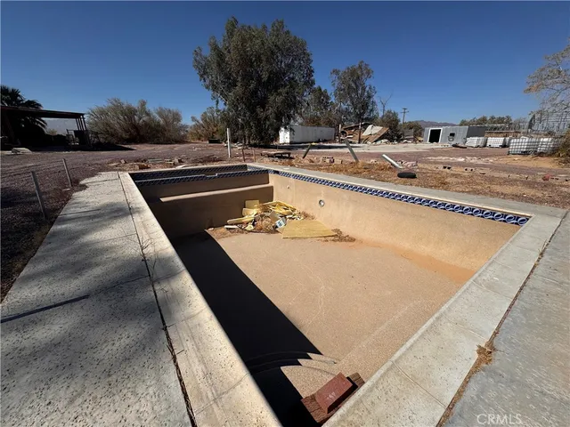 a view of a swimming pool with a lounge chair