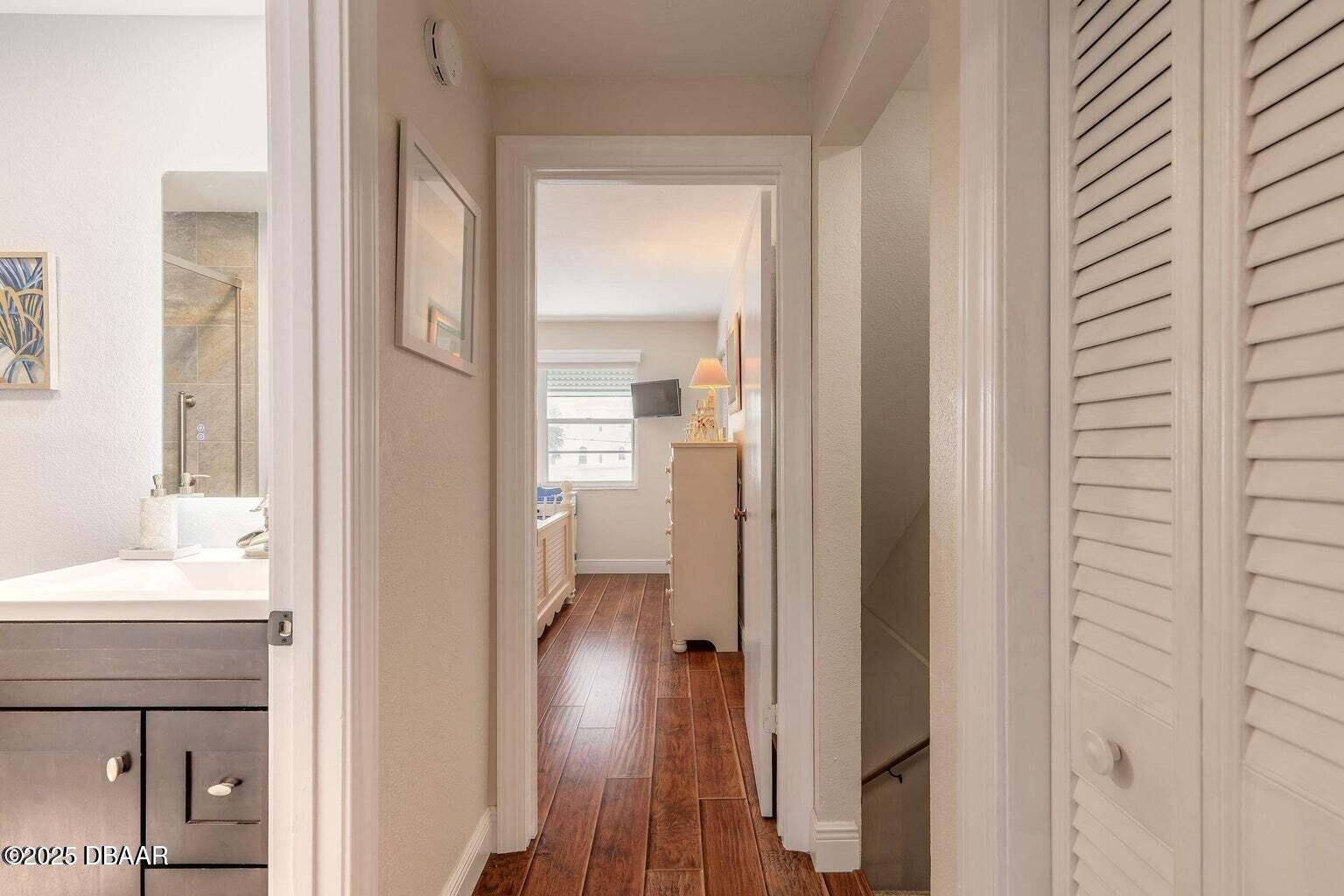 2750 Ocean Shore Boulevard, Unit 19 Ormond Beach, FL 32176 - Photo 14 of 23 a view of a bathroom from a hallway
