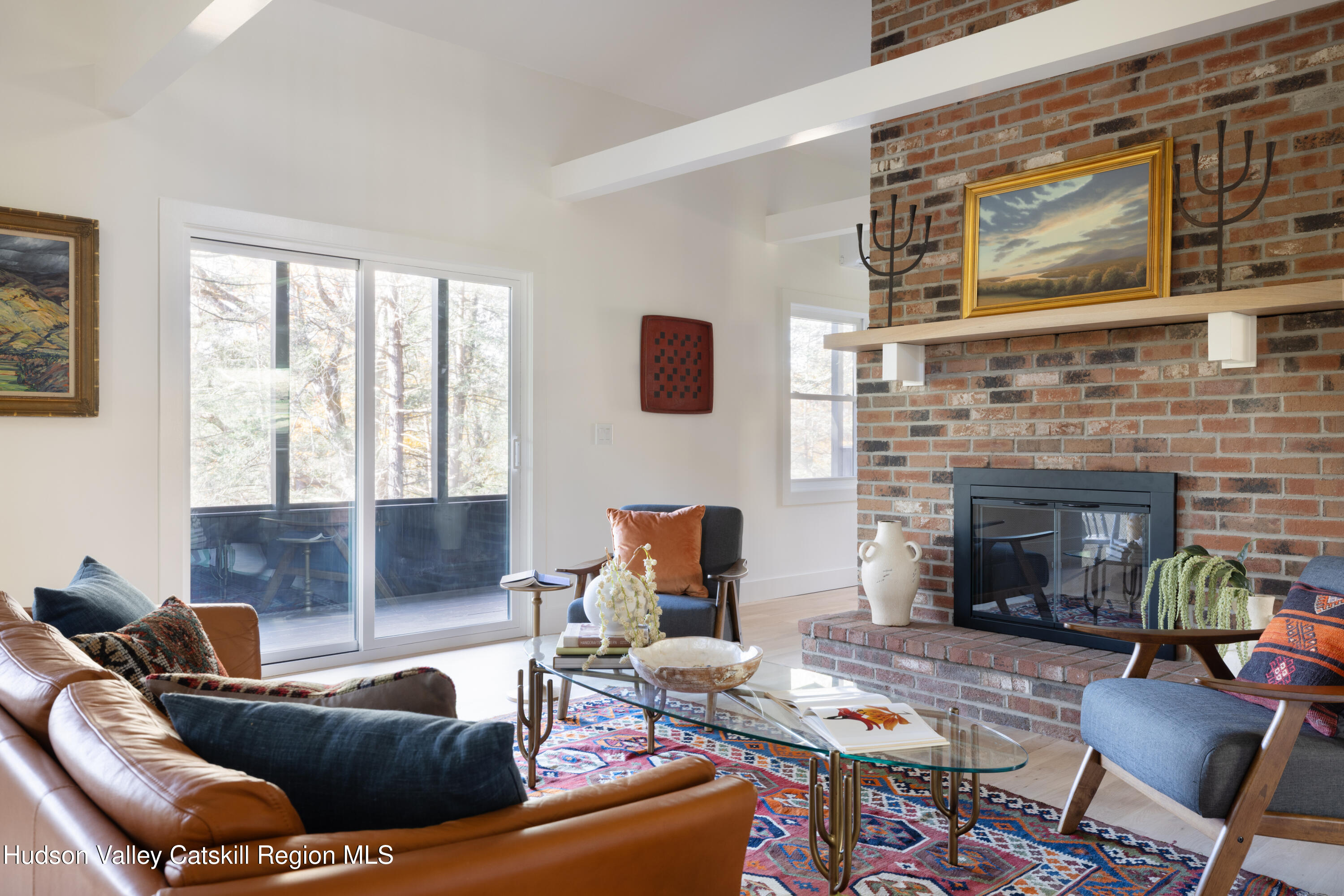 8 Watch Hill Road New Paltz, NY 12561 - Photo 11 of 30 a living room with furniture and a fireplace