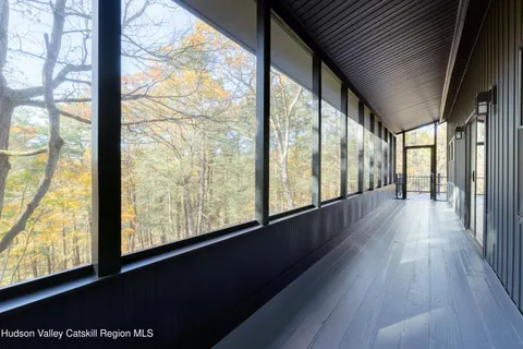 a view of hallway with wooden floor