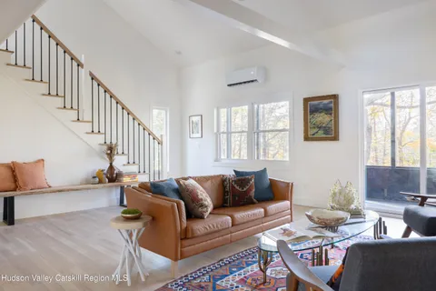 a living room with furniture or couch and a window