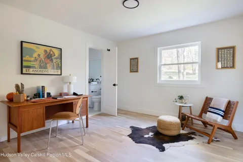 a workspace with furniture and wooden floor