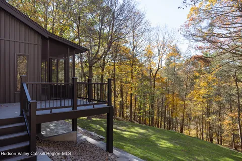 a view of a bench in the backyard