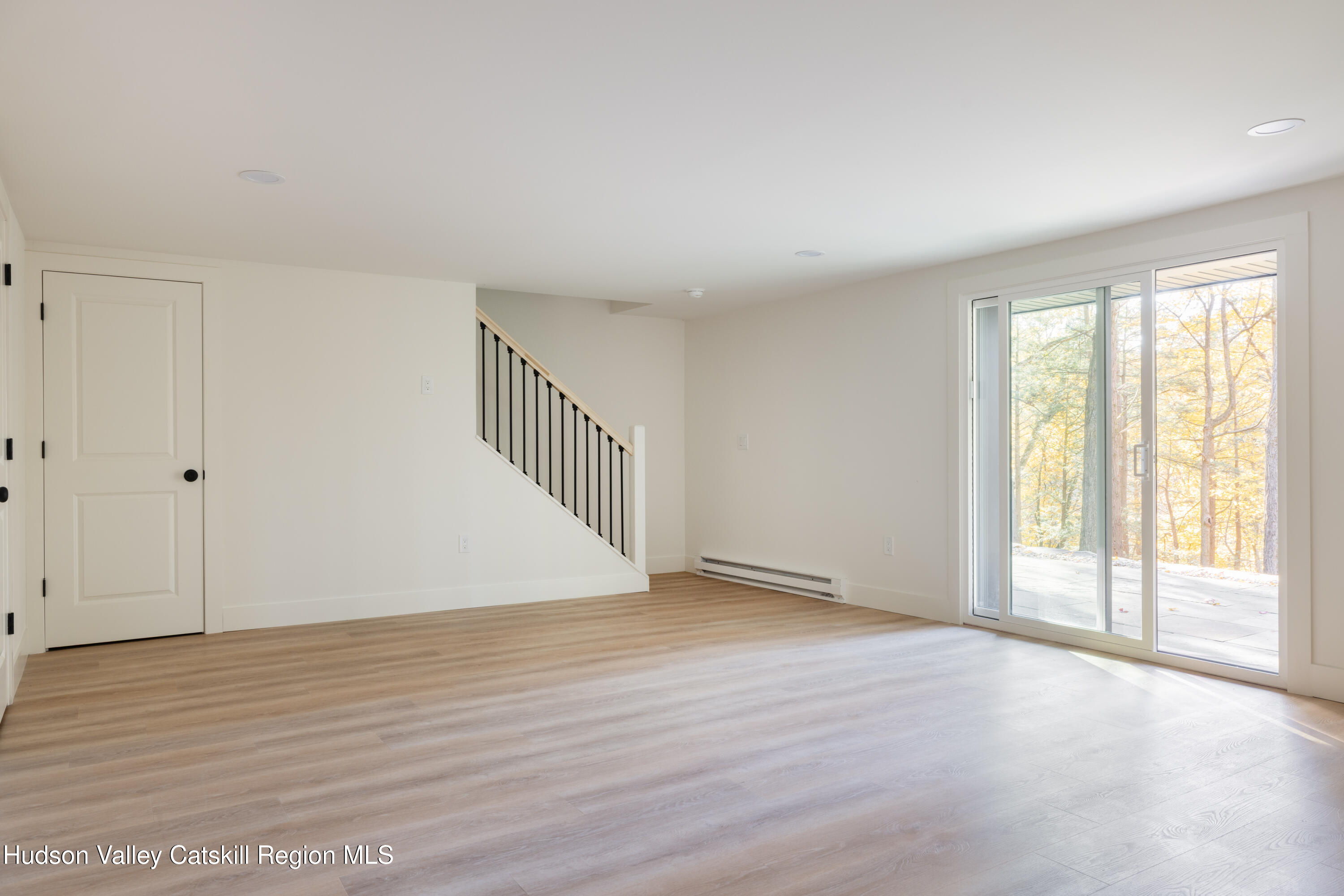 8 Watch Hill Road New Paltz, NY 12561 - Photo 24 of 30 a view of an empty room with wooden floor and a window