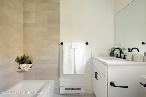 a bathroom with a sink and mirror