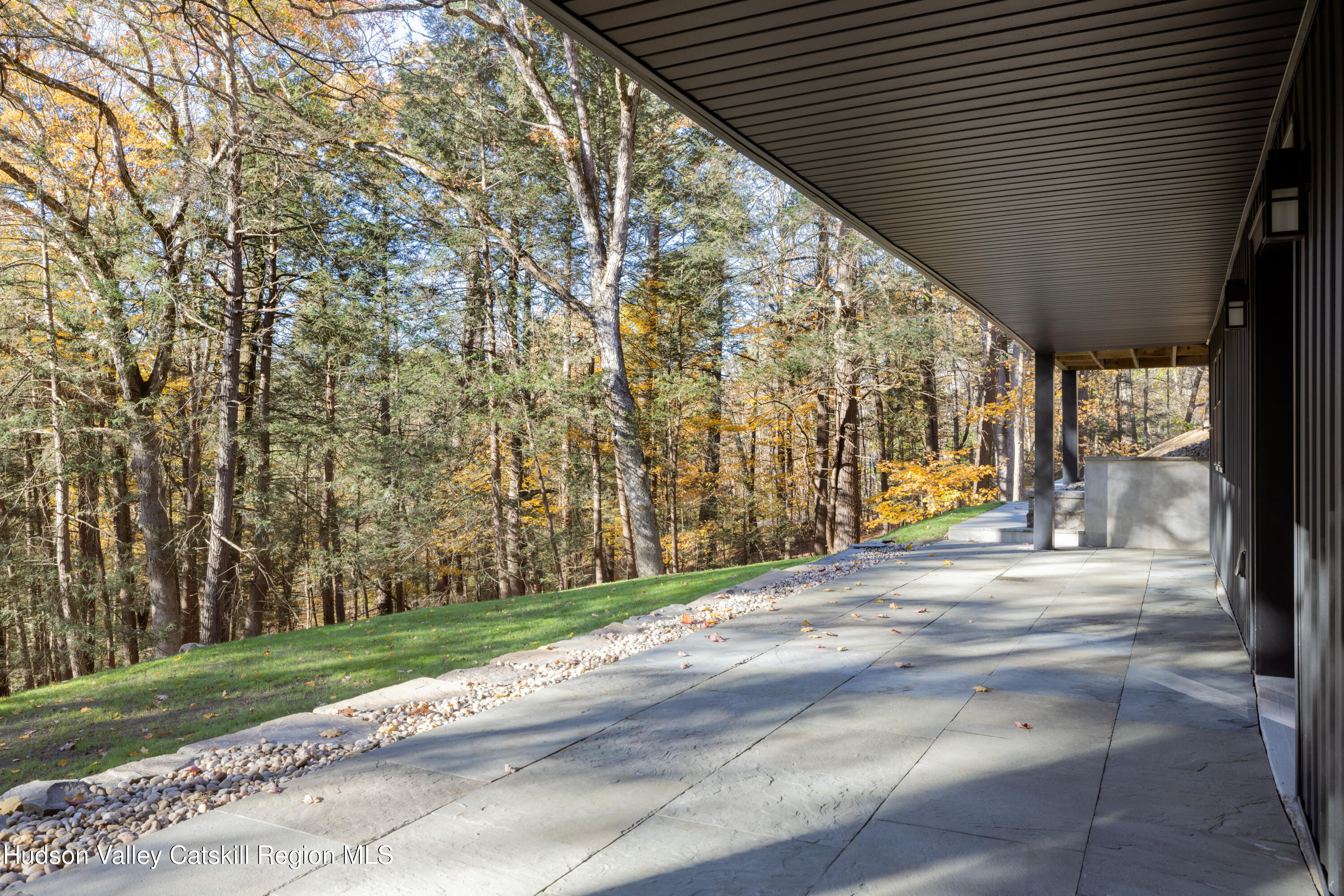 8 Watch Hill Road New Paltz, NY 12561 - Photo 26 of 30 a view of a patio with a table and chairs next to yard with wooden fence