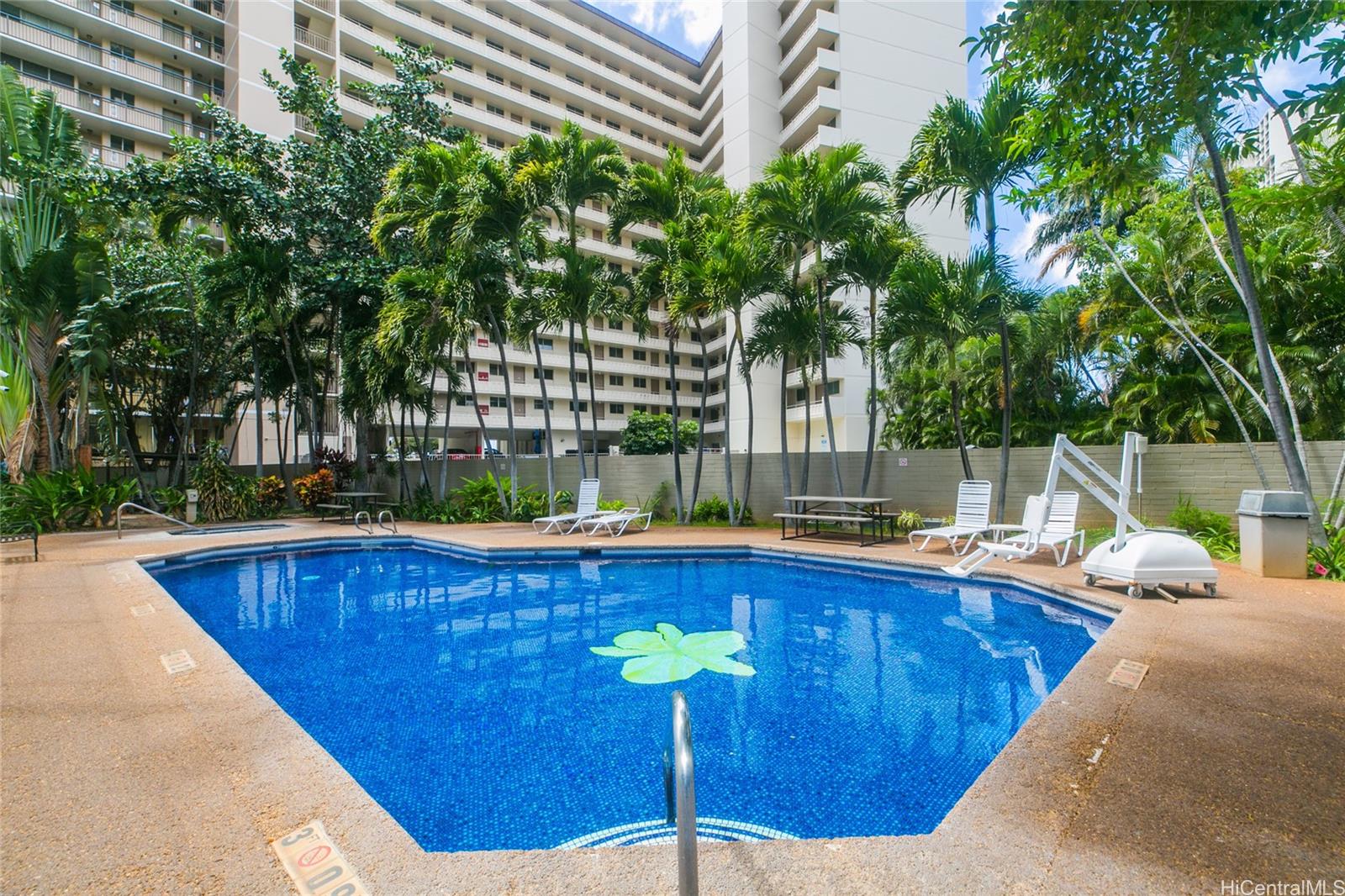 1700 Ala Moana Boulevard, Unit 603 Honolulu, HI 96815 - Photo 2 of 10 a view of a swimming pool with a lounge chair
