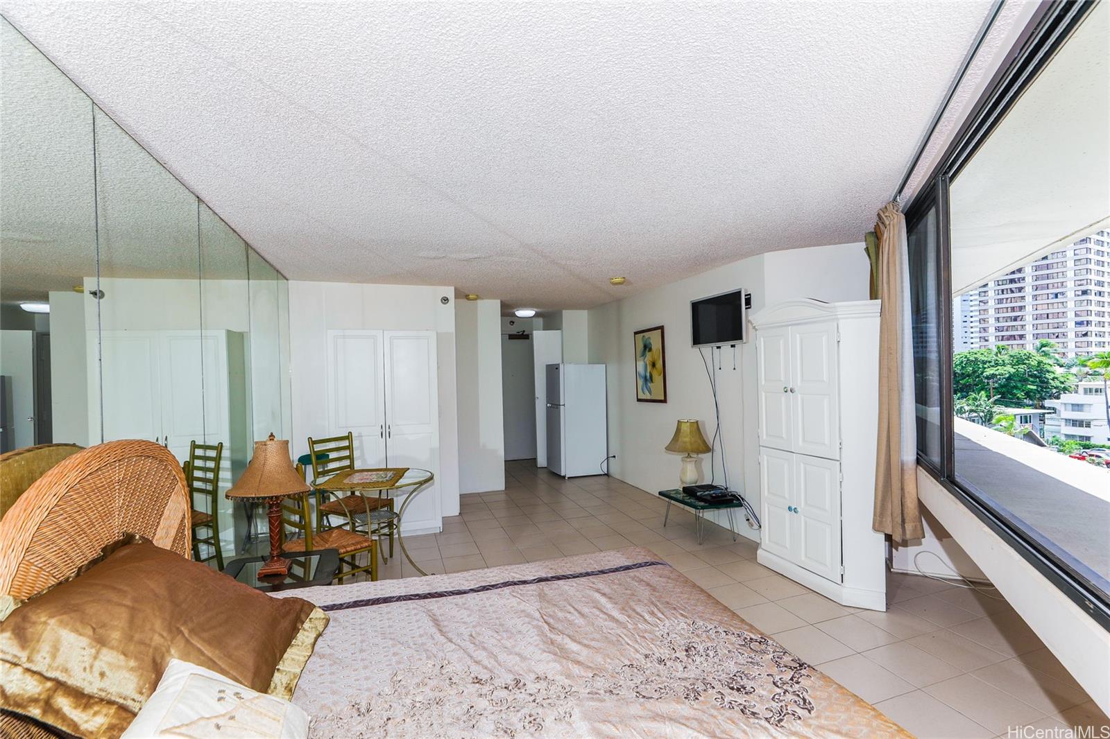 1700 Ala Moana Boulevard, Unit 603 Honolulu, HI 96815 - Photo 5 of 10 a living room with furniture and a rug