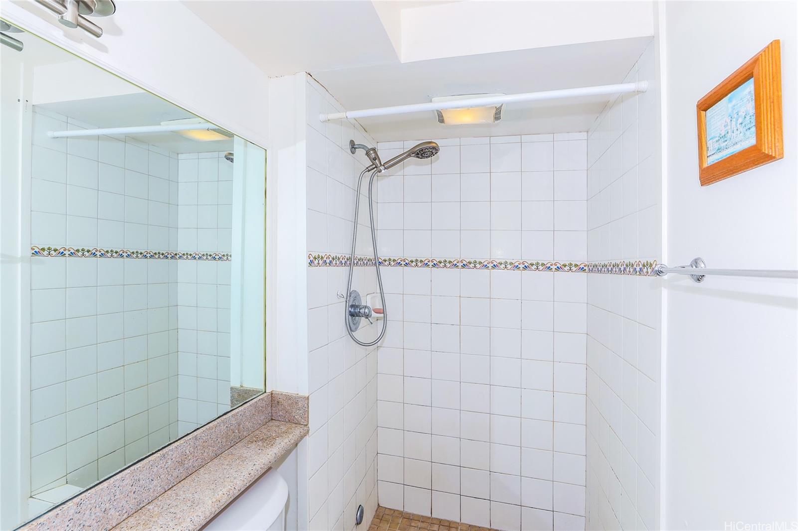 1700 Ala Moana Boulevard, Unit 603 Honolulu, HI 96815 - Photo 9 of 10 a bathroom with a shower