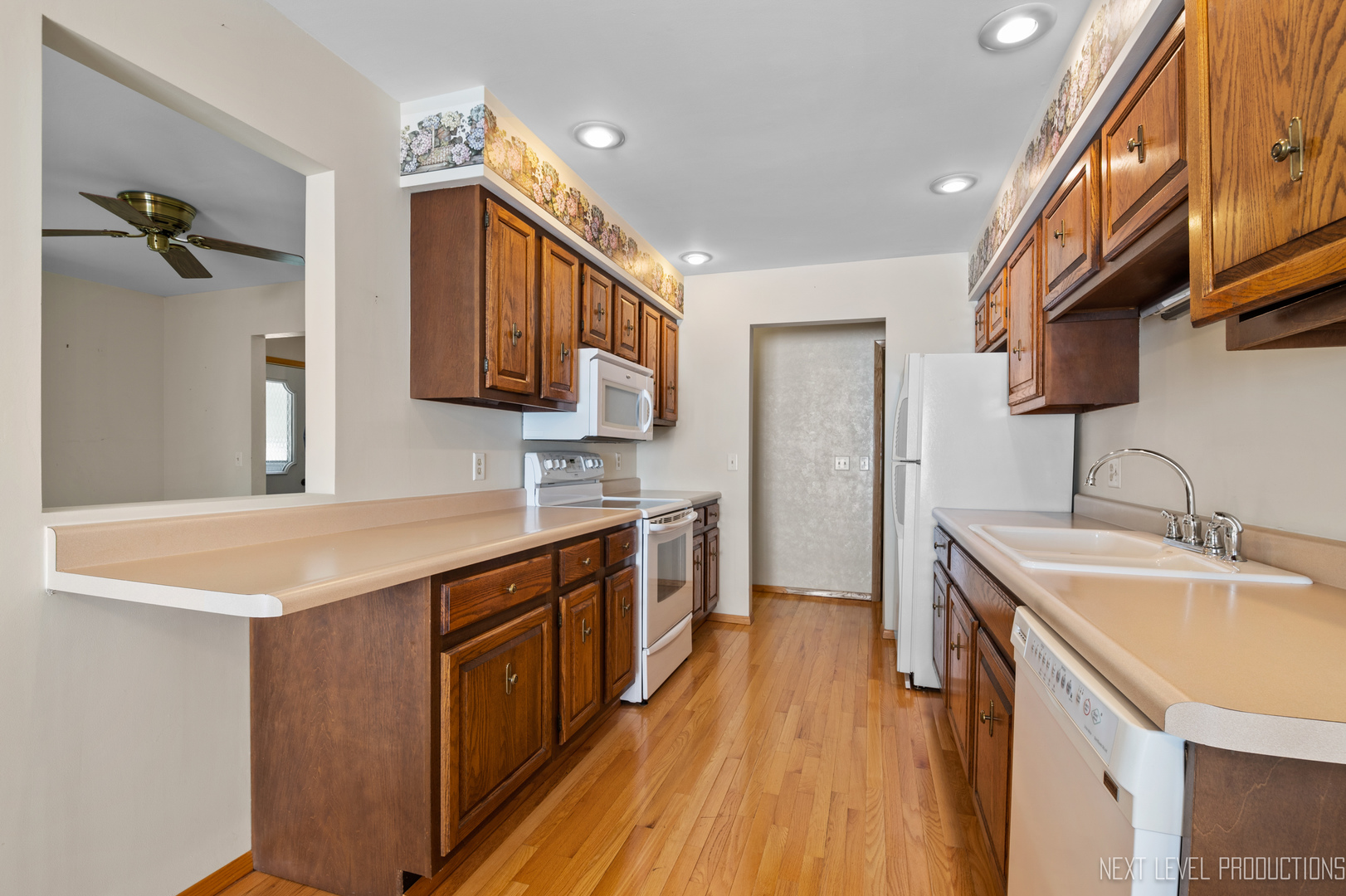 38 Sherwick Road Oswego, IL 60543 - Photo 13 of 25 a kitchen with a sink and a stove top oven