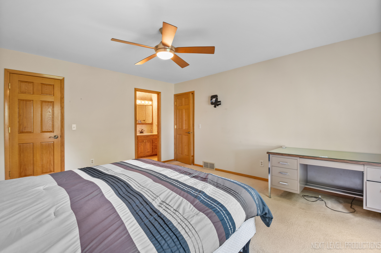 38 Sherwick Road Oswego, IL 60543 - Photo 21 of 25 a bedroom with a bed and a chandelier