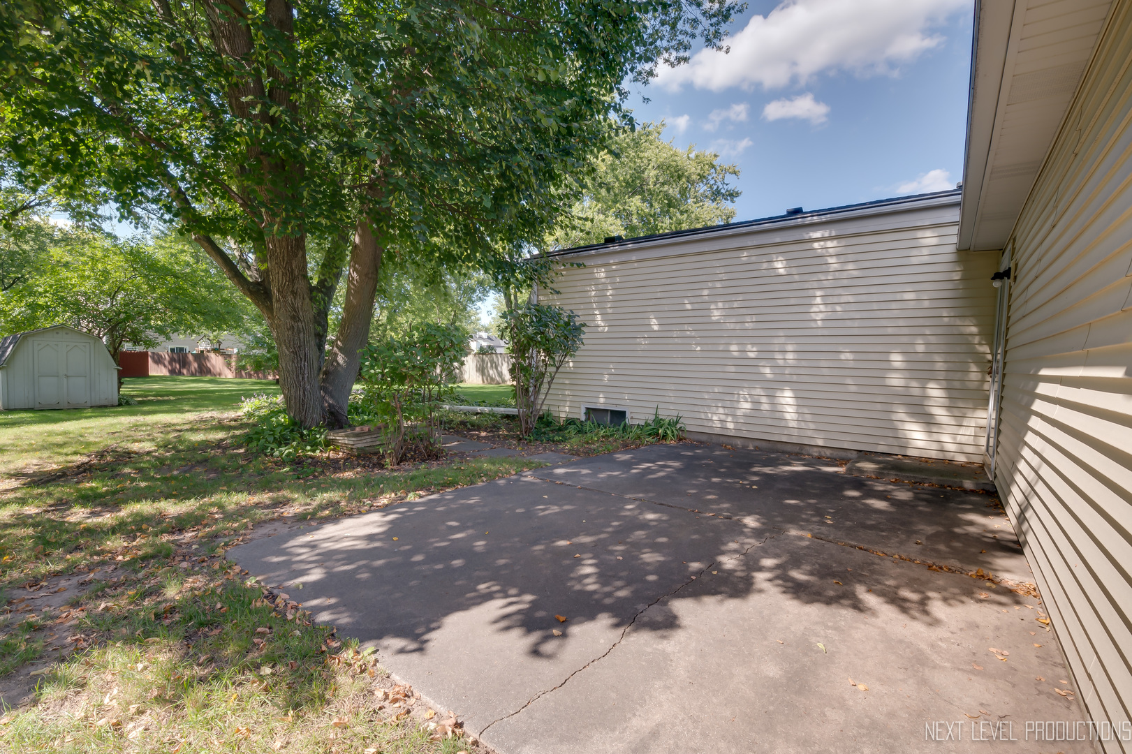 38 Sherwick Road Oswego, IL 60543 - Photo 4 of 25 a view of a house with backyard and trees