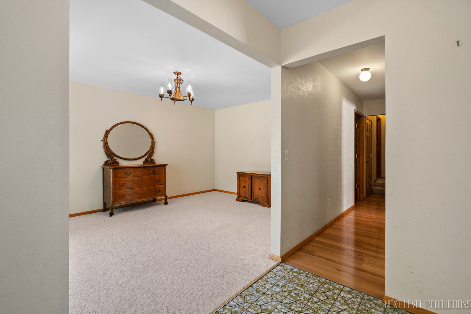 38 Sherwick Road Oswego, IL 60543 - Photo 6 of 25 a view of a hallway with entryway wooden floor and front door
