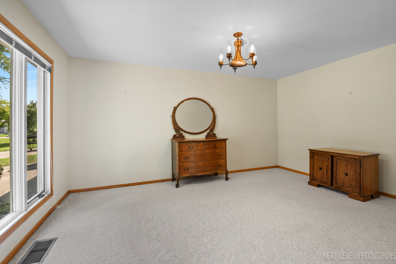 38 Sherwick Road Oswego, IL 60543 - Photo 7 of 25 an empty room with toys and mirror