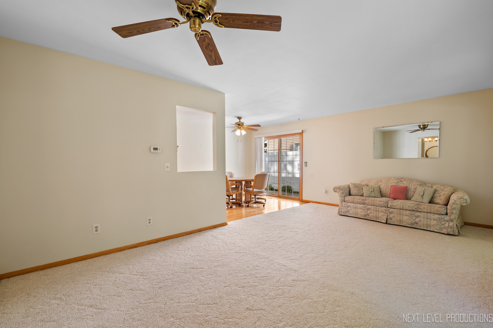 38 Sherwick Road Oswego, IL 60543 - Photo 10 of 25 a living room with furniture and a ceiling fan