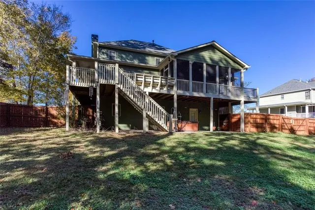 a view of a livingroom with a ceiling fan and window