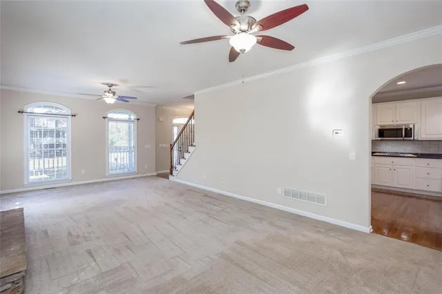 a large kitchen with stainless steel appliances and a counter top space