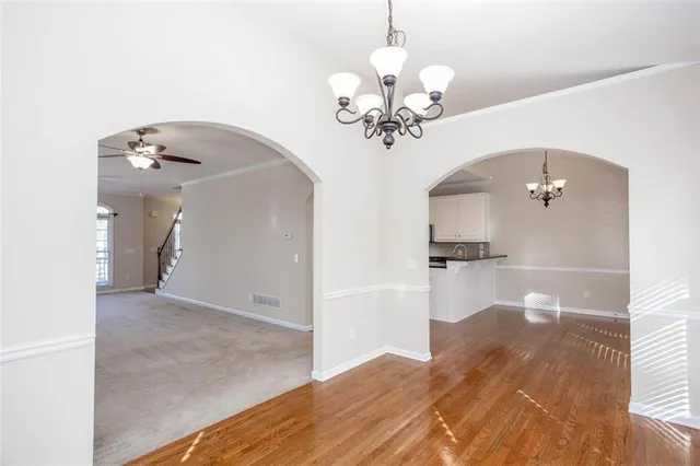a kitchen with granite countertop a stove a sink and a granite counter tops